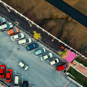 Overhead view of cars in parking lot Overhead view of cars in parking lot